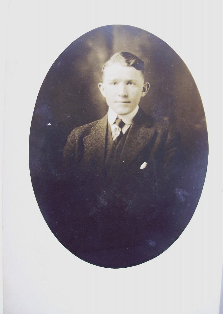 1910's photo of young man known as Rueben Richardson. Wearing a suit and tie.