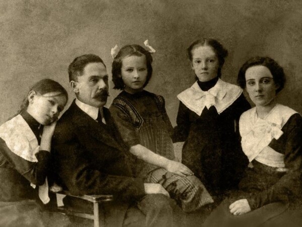 black and white old photo of parents and 3 young girls