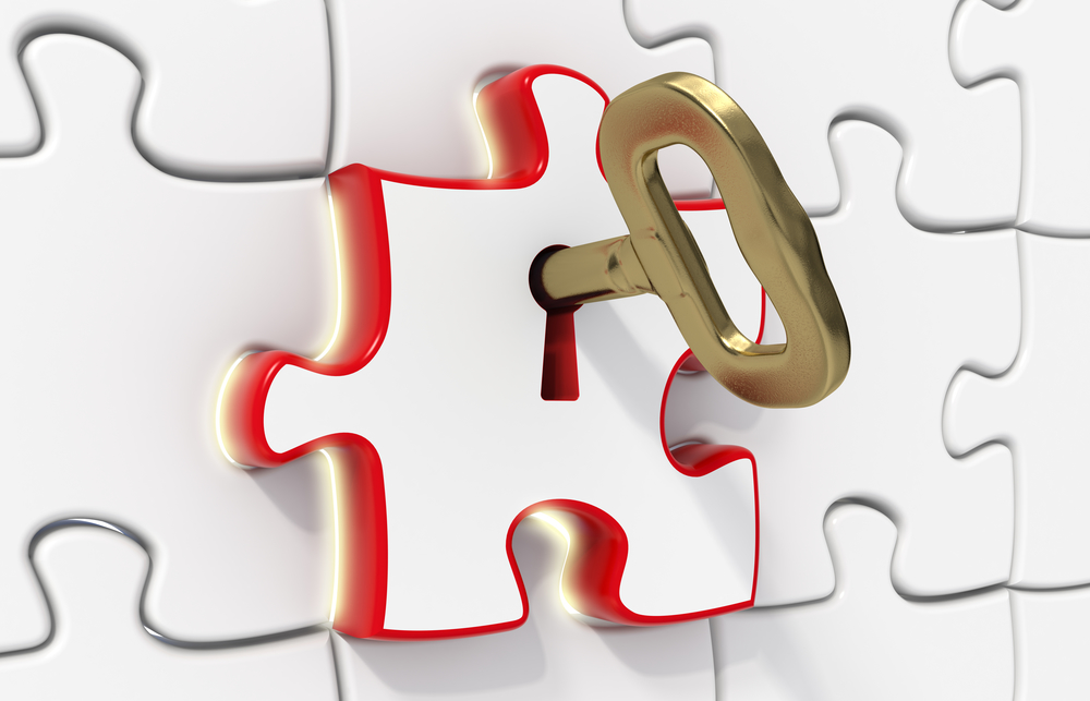 3d rendered puzzles - one red opened with a gold key - Light effect - Solution concept
