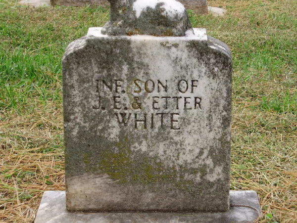 Small tombstone with lamb on top for Elgin White